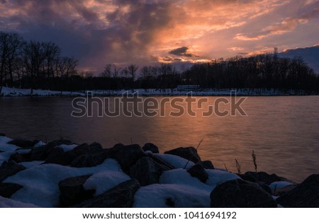 Dramatic winter sunset on the lake. Mercer County, New Jersey 