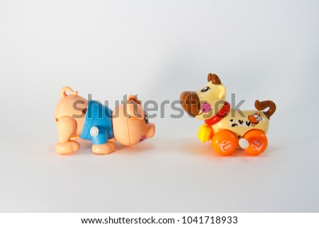 Pig and Cow, Plastic Toy Animal isolated on white background.