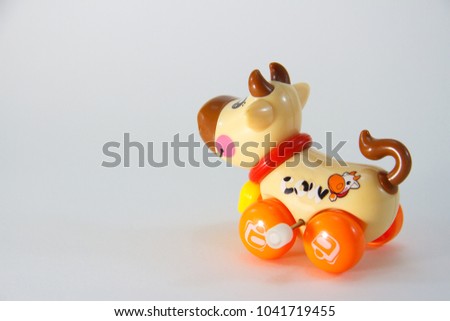 Cow, Plastic Toy Animal isolated on white background.