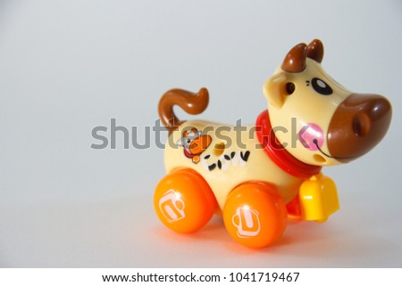 Cow, Plastic Toy Animal isolated on white background.