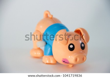 Pig, Plastic Toy Animal isolated on white background.