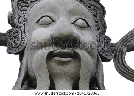 Close up the face of Chinese stone curving in Wat Pho Bangkok Thailand