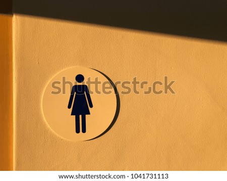 Women toilet symbol sunset