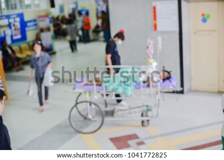 Blurred image of patients with treatment in the hospital.