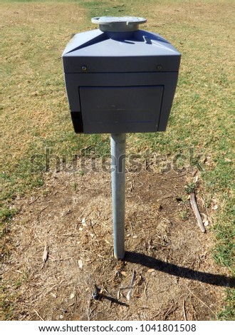 Golf ball washer mail box light switch outdoors hanging on a pole