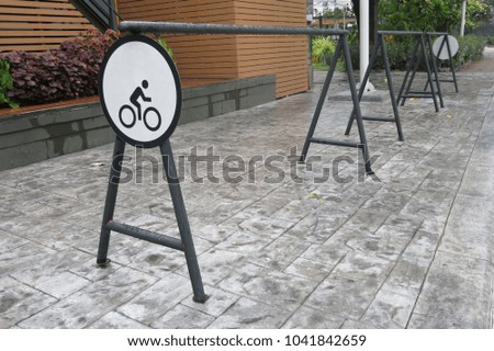 Sign or symbol for the bike parked , in front of the cafe or the shop
