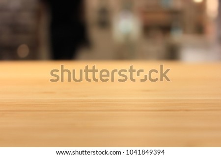 Image of wooden board and kitchen blurred.