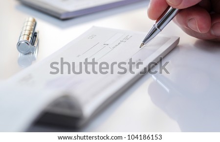 Business man prepare writing a check Royalty-Free Stock Photo #104186153