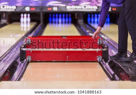professional maintenance and oiling of a bowling lane  with a automated conditioning machine