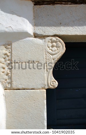 Ancient stone on a house's entry in Kastro traditional village, Sifnos island, Greece.