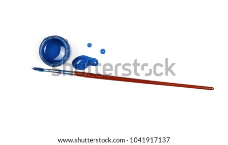 Spilled blue watercolor with bottle and paintbrush isolated on white background, top view Royalty-Free Stock Photo #1041917137
