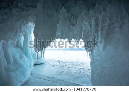 The Lake Baikal is located in southern Siberia of Russia. In the winter the lake and the surrounding area becomes ice. Water that falls down the cracks of grotto accumulates and becomes thick icicles.