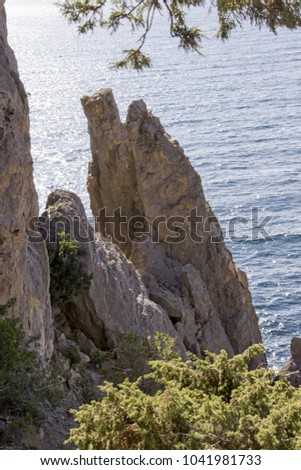 Seascape view of the blue sea and high cliffs
