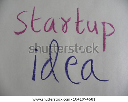 Text startup idea hand written by colorful oil pastels on white color paper
