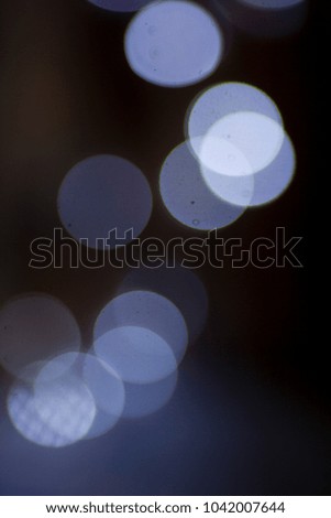 Glitter vintage lights background. light silver, blue and black. defocused