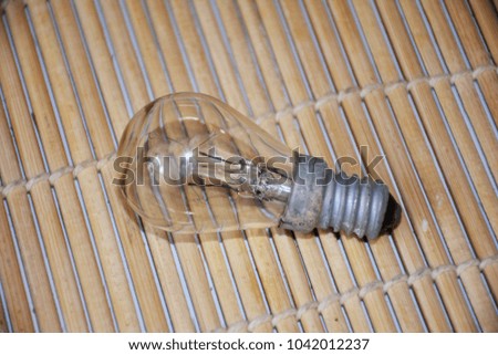 Light bulb on brown background.