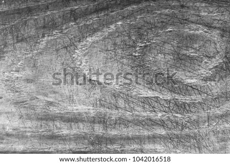 Old wooden gray background with a scratch. Real wood texture. Vintage wallpaper.