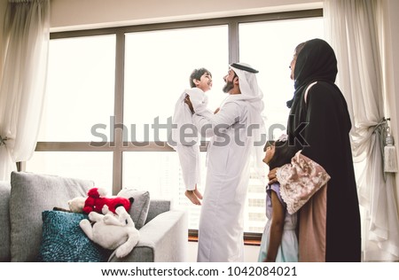 Arabic happy family lifestyle moments at home Royalty-Free Stock Photo #1042084021