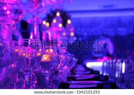 Wedding hall or other function facility set for fine dining Royalty-Free Stock Photo #1042101292
