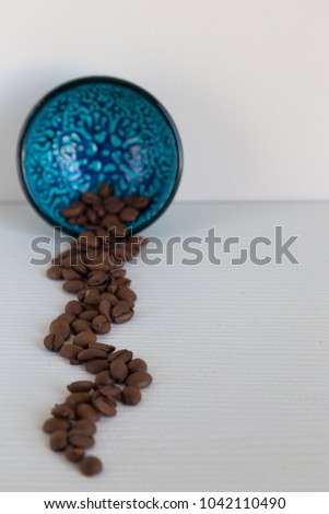 Coffee in the blue plate on the white background. 