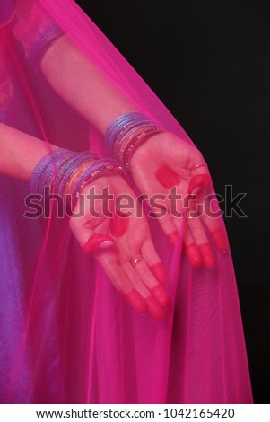 A woman is dancing an Indian dance. Hands close-up.