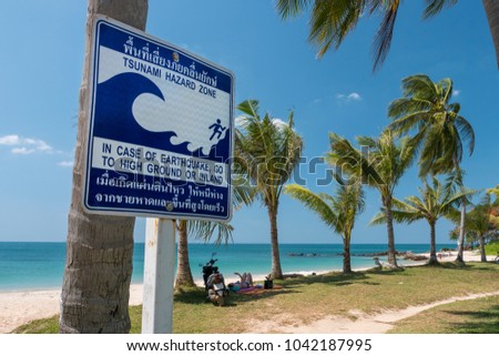 tsunami signboard in the beach, thailand, ko lanta island