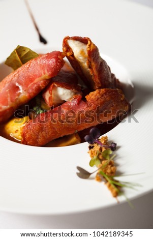 Fried beacon with cheese and vegetables. Restaurant menu