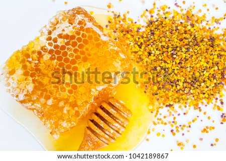 honey and pollen Royalty-Free Stock Photo #1042189867
