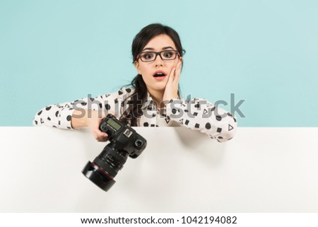 Young woman with camera