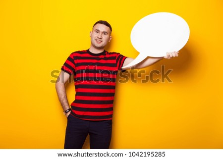 Handsome man in bright T-shirt with speech bubble