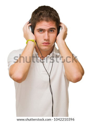 Young Man Listening On Headphones On White Background