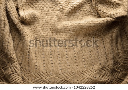 Beige Sweater. Elements of Knitted Sweater as Background