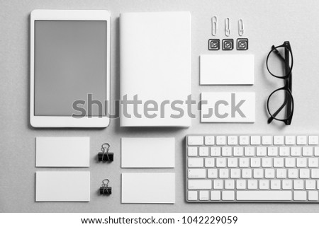 Set of devices and stationery on grey background. Mockup for design