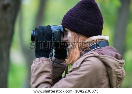 beautiful woman tourist travel photographer photographing forest at autumn day Odessa