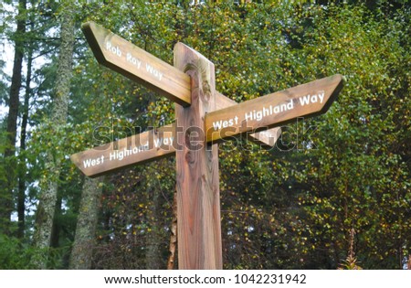 Signpost marking the way on the West Highland Way in Scotland Royalty-Free Stock Photo #1042231942