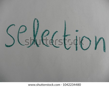 Text selection hand written by green oil pastel on white color paper