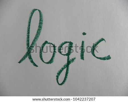 Text logic hand written by green oil pastel on white color paper