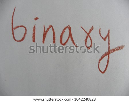 Text binary hand written by brown oil pastel on white color paper