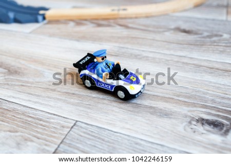 toy police car with an officer
