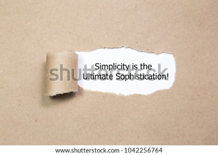 Motivational quote Simplicity is the Ultimate Sophistication, appearing behind torn paper.