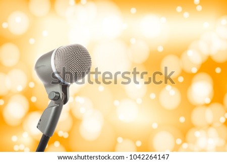 microphone on a background of golden bokeh