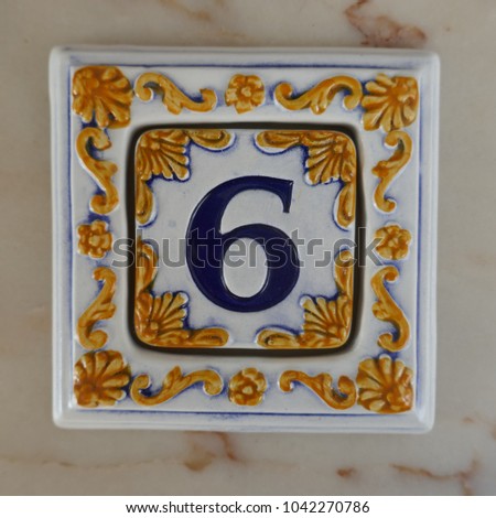 Number 6, portuguese or spanish ceramic tiles with digits for house number signs.