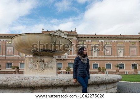 Horizontal picture of woman posing at the Vatican Museum in Rome, Italy