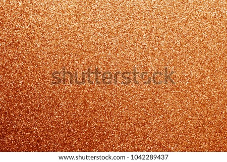 Glittering background in orange color. Abstract background and texture for design.