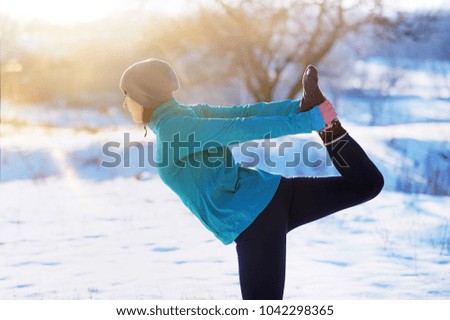 Closeup picture of the King of the dance yoga Pose in winter