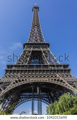 The Tour Eiffel (Eiffel Tower) close up. Eiffel Tower is tallest structure in Paris and most visited monument in the world. Paris, France.