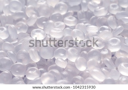 Polypropylene granule close-up background texture. Royalty-Free Stock Photo #1042315930