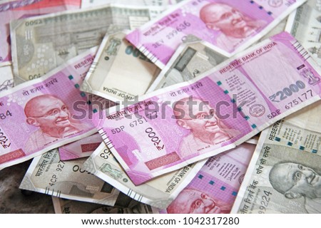 Indian money and banknotes, 500 rupees and 2,000 rupees. Background of paper Indian money. Royalty-Free Stock Photo #1042317280