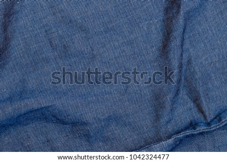Pure Denim Hemp texture. Wrinkled denim jeans from hemp  and cotton fabric background. 50 % Natural Hemp 50 % Cotton texture