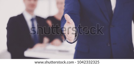 Closeup of a business handshake in office